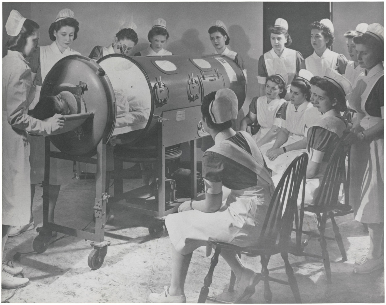 Nurses Being Instructed on the Use of Respirator for a Polio Patient